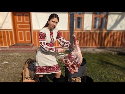Woman lives in village. Cooking TRADITIONAL Crimean Tatar dishes with lamb. Pilaf and chebureks
